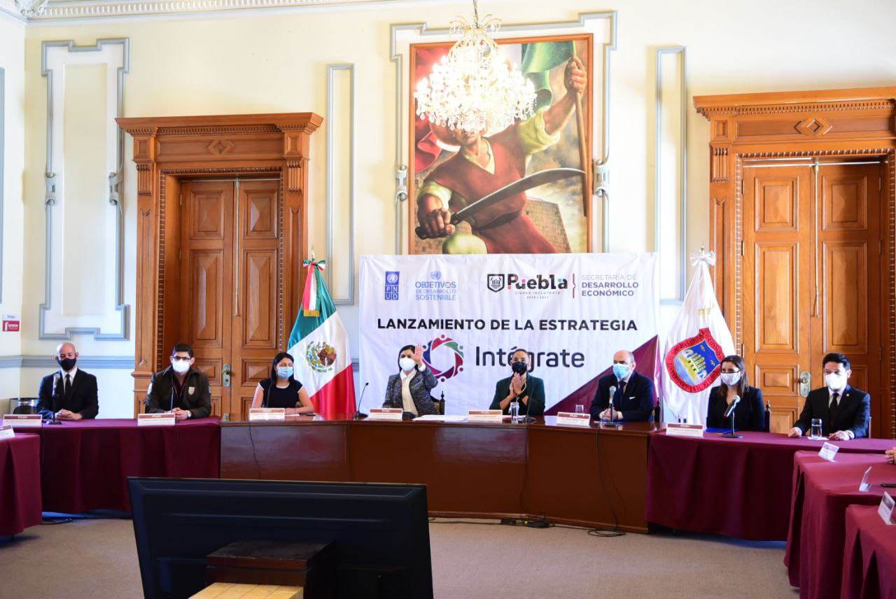 Inserción laboral migrantes Puebla